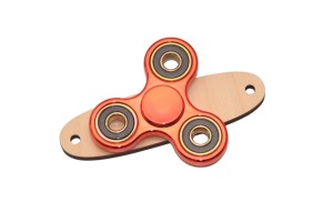 Czerwony spinner do tablicy sensorycznej na podstawce.   