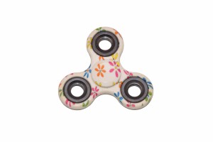 Kolorowy spinner w kwiatuszki. Zabawka antystresowa, zręcznościowa.   